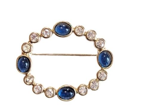 Vintage Cabouchon brooch with gold plating, blue stones and rhinestones.