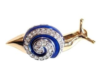 Vintage Cabouchon brooch from the Snail collection with gold plating, blue enamel and Austrian crystals.