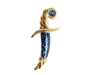 Vintage Cabouchon  brooch depicting a sword in a shield with gold plating, blue enamel and a blue stone.