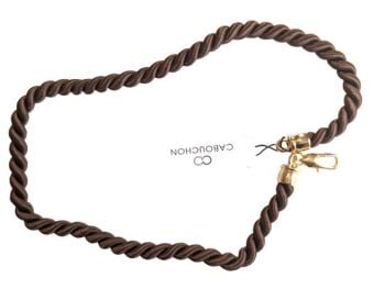 Vintage Cabouchon dark brown cord necklace with a gold plated clasp. Size large.