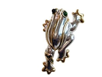 Vintage Cabouchon  frog tac-pin with rhodium and gold plating. The eyes are green.