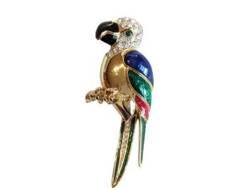 Vintage Cabouchon parrot brooch with gold plating, dark  blue, red, green and black enamel and Austrian crystals. The eyes are green.