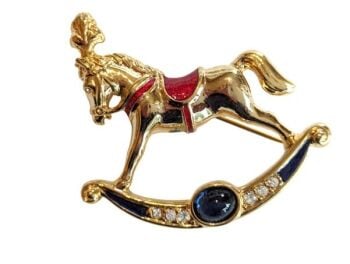 Vintage Cabouchon rocking horse brooch  with gold plating, red and dark blue enamel, a blue stone and Austrian crystals.