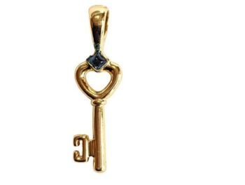 Vintage Cabouchon gold plated key pendant  with a blue stone.