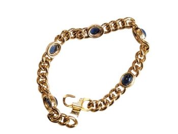 Vintage Cabouchon gold plated bracelet with 5 sapphire coloured blue stones.  Size large.