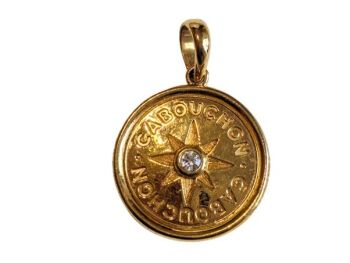 Vintage Cabouchon gold plated pendant  with an Austrian crystal on one side and a blue stone on the other side.