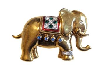 Vintage Cabouchon elephant brooch with gold plating, red enamel, green and light blue diamantés and Austrian crystals.