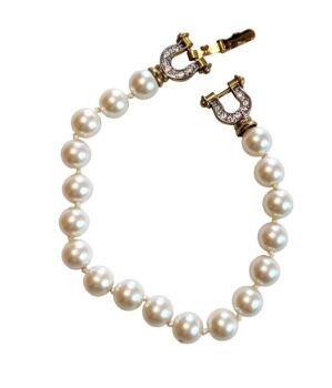 Vintage Cabouchon high quality faux pearl bracelet with a gold plated horseshoe shaped clasp with stunning Austrian crystals. Size medium.