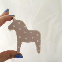 mini horse spots on pink background
