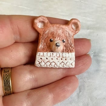 Pin #41 brown bear in Aran jumper