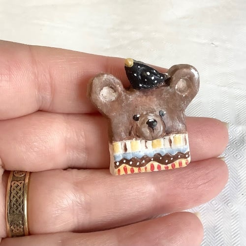 Pin #44 brown bear with bird and Fair Isle jumper