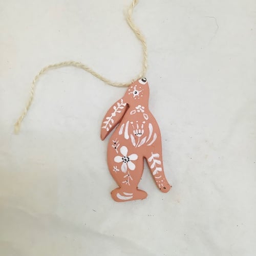 Hare dangle-terracotta and white- left facing