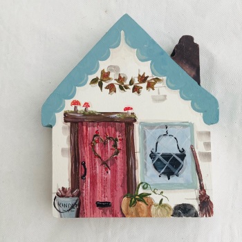 A small house - teal roof