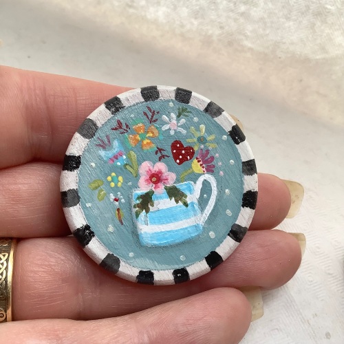 Pin - flowers in a mug, teal background
