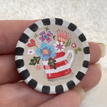 Pin - flowers in a mug, putty background