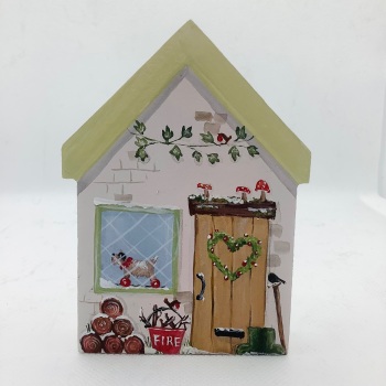 A small house - logs and wellies