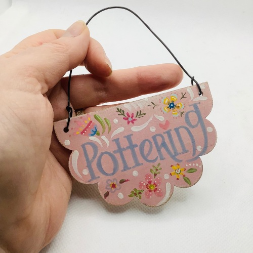 Mini sign ‘pottering’