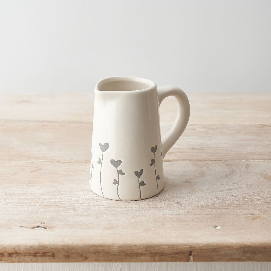 Cream ceramic jug with pretty grey floral and heart design.