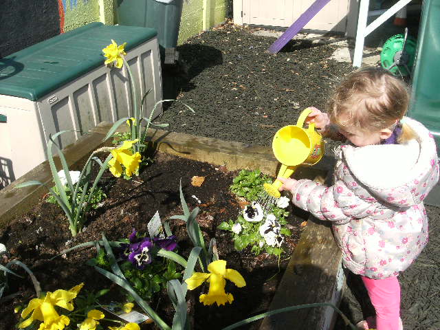 Child Watering Plants