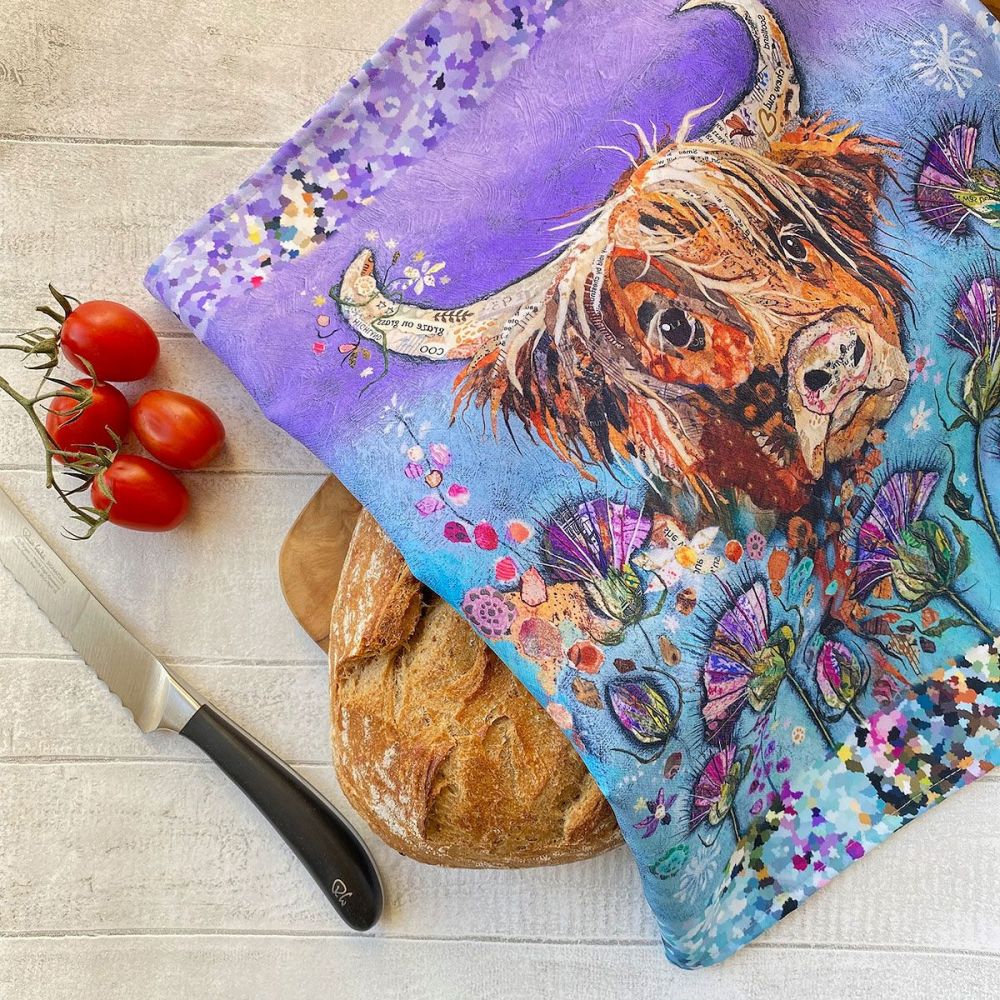 Thistle Coo - Highland Cow Tea Towel over bread