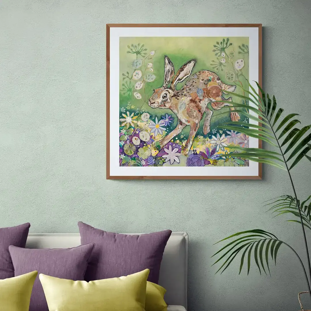 hare fine art print by Dawn Maciocia featuring a leaping hare which is hanging on a wall in a room setting