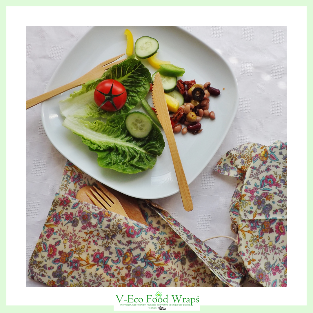 V-Eco Food Wrapsâ„¢,  CutleryCaddyâ„¢ - waxed pouch with bamboo cutlery and a plate of salad