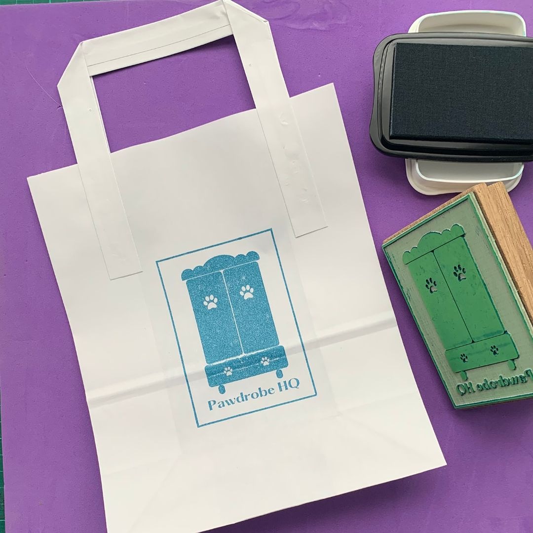Eco-friendly packaging with a hand-stamped Pawdrobe HQ logo
