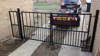 Fit a pair of gates with posts in to concrete