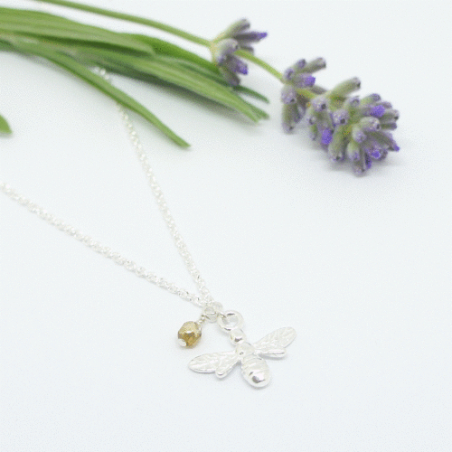 Sterling Silver Bee charm necklace with glass bead detail.