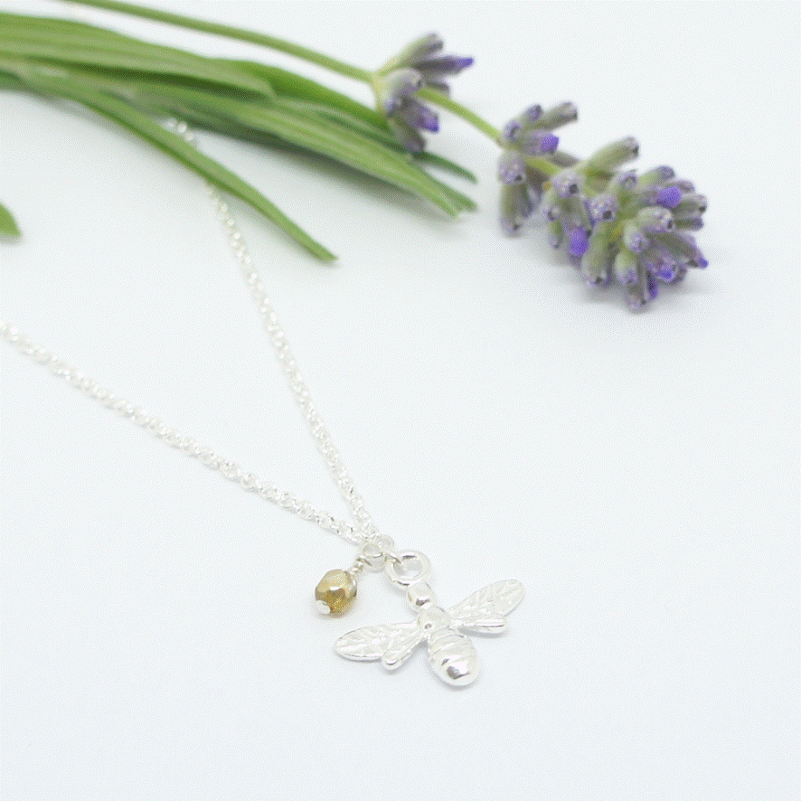 Sterling Silver Bee charm necklace with glass bead detail.