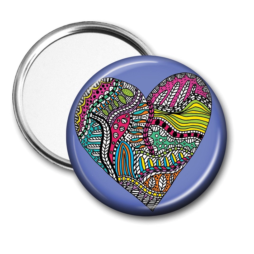 Colourful doodle heart pocket mirror with blue background