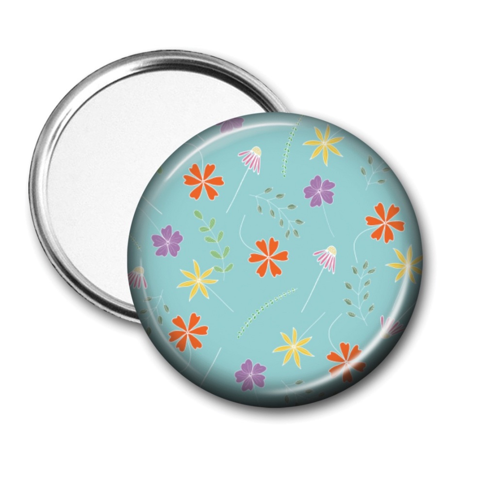 Pocket mirror with floating flowers on a turquoise background