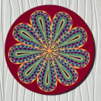 Circular red coaster with stylised flower decoration