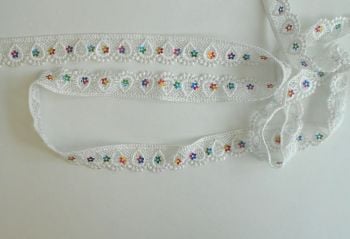 WHITE TRIM WITH MULTI COLOURED FLOWERS