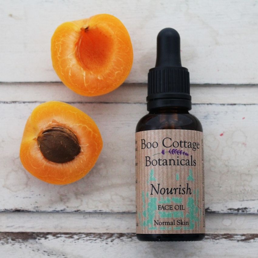 Nourish face oil in amber bottle with pipette top.