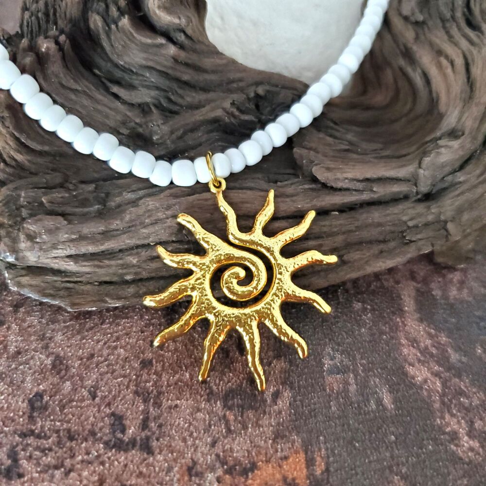 Gold Sunburst Necklace: Spiral Stainless Steel Celestial Pendant, White beaded