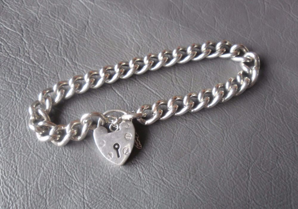 Traditional vintage sterling silver charm bracelet
