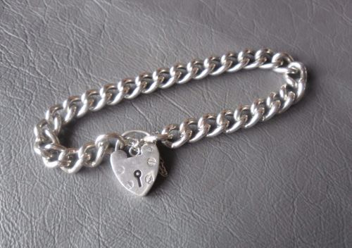 Traditional vintage sterling silver charm bracelet