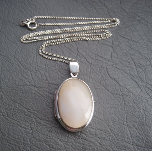 Sterling silver locket with a Mother of Pearl front