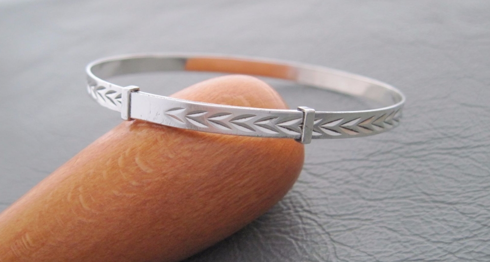 Vintage silver Christening bangle with a chevron design