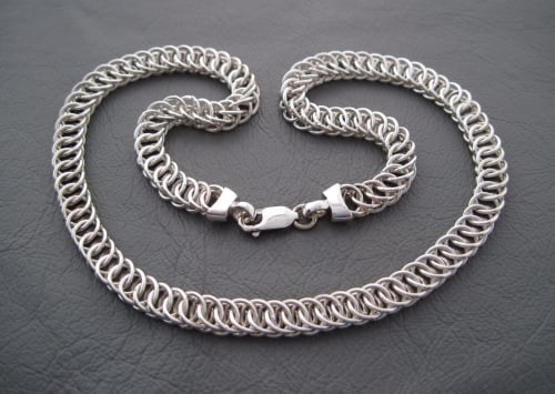 Heavy sterling silver necklace with woven circular links