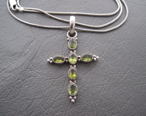 Sterling silver necklace with a peridot set cross pendant