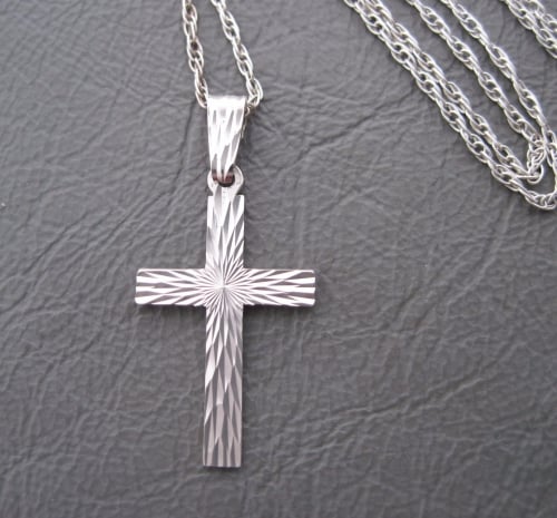 Vintage sterling silver necklace with an engraved cross pendant