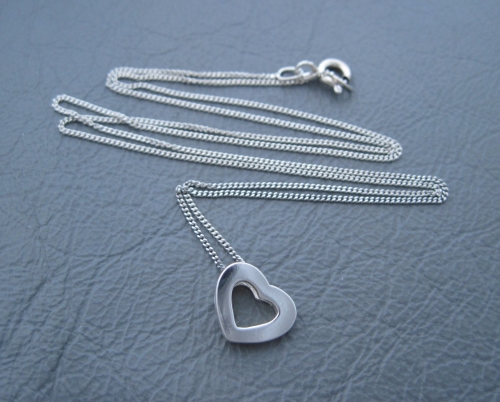 Sterling silver necklace with a small dimensional heart pendant