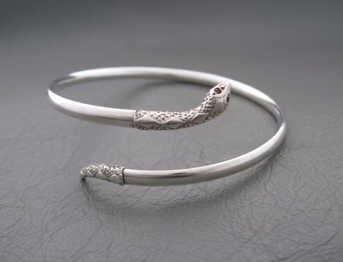 Vintage silver snake wrap bangle with garnet eyes