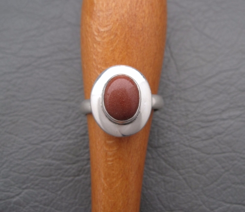 Sterling silver mounted goldstone ring