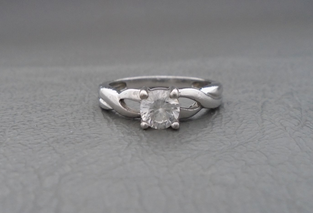 Sterling silver solitaire ring with twisted shoulders