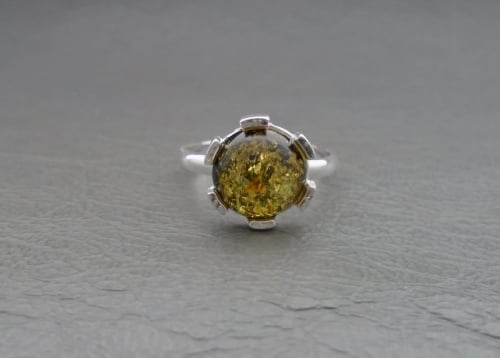 (NEW) Sterling silver ring with a circular green amber cabochon