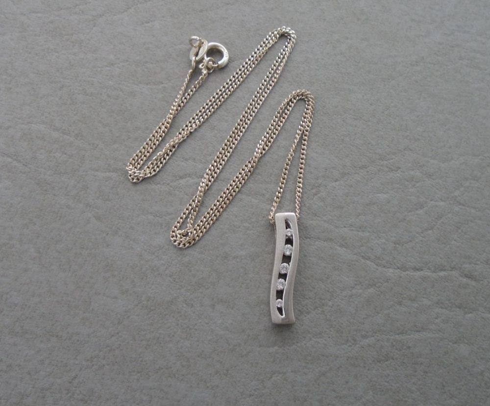 Sterling silver necklace with a 5 graduated stone wave pendant