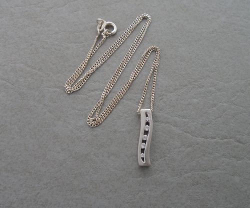Sterling silver necklace with a 5 graduated stone wave pendant